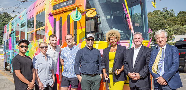 TTC Staff in front of Streetcar Named Toronto streetcar