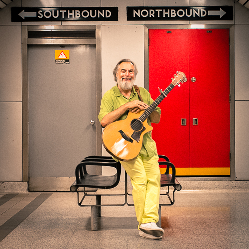 Joseph Taylor playing a guitar.