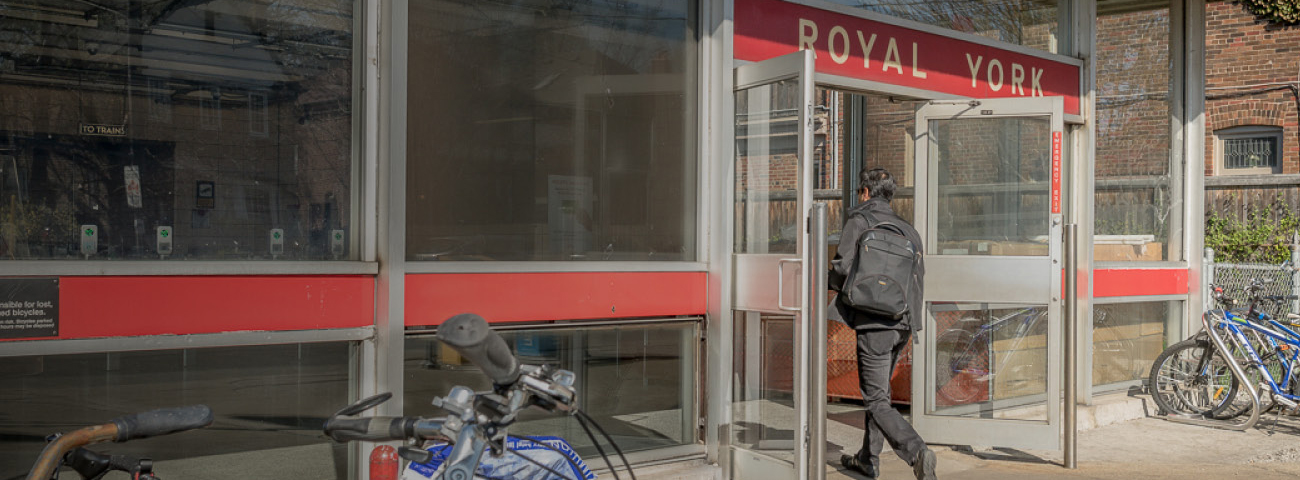 Passenger entering Royal York Station next to Bike Stand