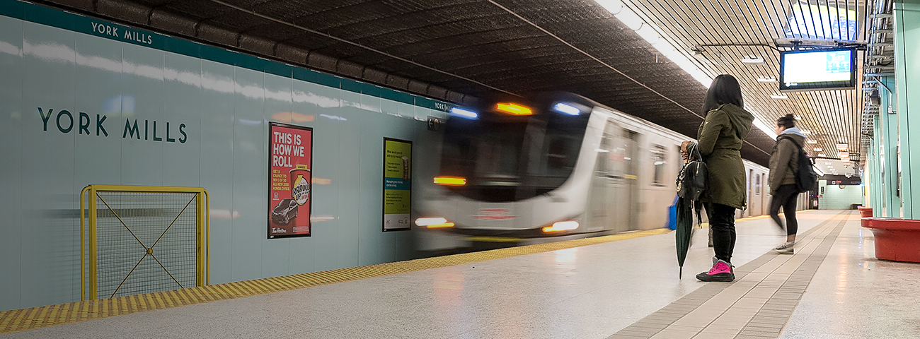 Passengers waiting for approaching train at York Mills Station